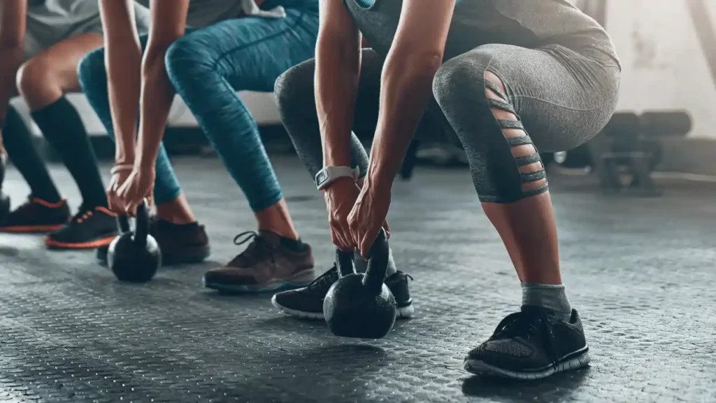 Toning Arms Without the Bulk: Is It Achievable? 2 Women performing bodyweight exercises for lean arms